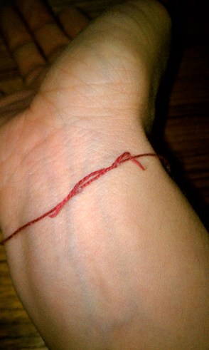 Kababy Bracelet, Red silk tied around my wrist